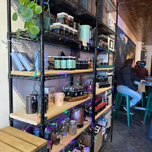 shelves of various types of tea in a coffee shop