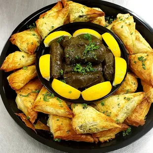 Catering---- Stuffed mini spinach and cheese pies and stuffed grape leaves platter