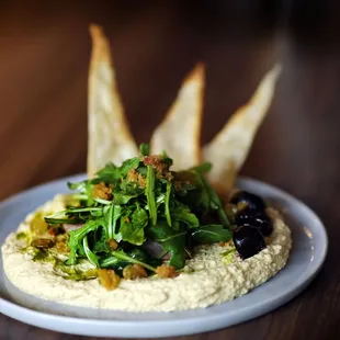 a plate of hummus and bread