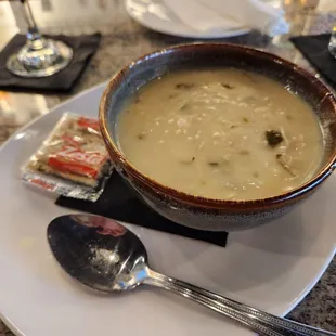 Avgolemono Soup with dirty spoon