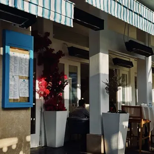Entrance and one side of outdoor seating. Very nice! It's a perfect golden hour spot.