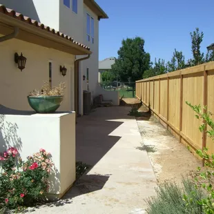 Cedar top cap style fence.