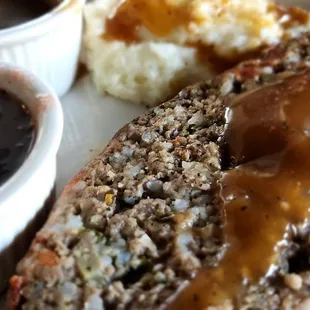 Meatloaf entrée with mash potato and gravy along with cranberry sauce (restaurant made).