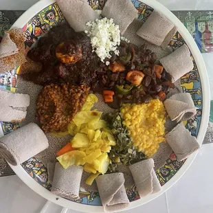 Veggie combo with tibs and key wat, plus Enjeera.