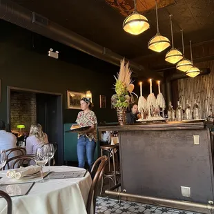 a woman standing at the bar