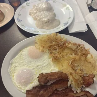 2 eggs over easy, bacon,crispy hash browns and biscuits and gravy.