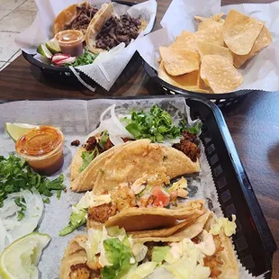 Shrimp and steak tacos with chips and Pico de Gallo and Birria tacos Good