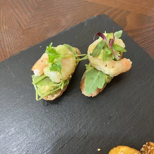 Garlic Shrimp and Arugula Crostini with an avocado spread