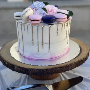 a white cake with pink and blue icing