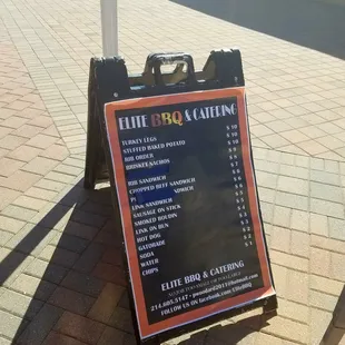 a menu on a sidewalk