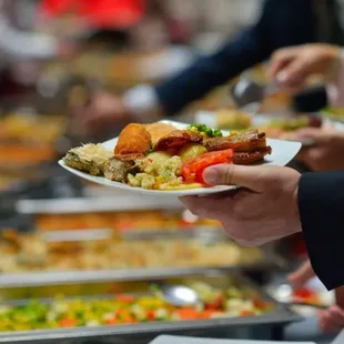 Elite Catering Las Vegas  - Guest enjoying a casual  buffet station.