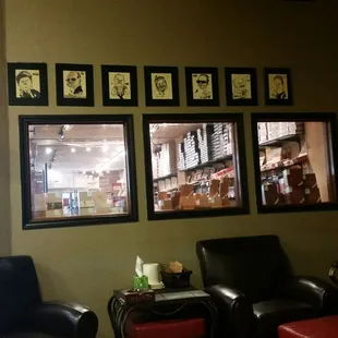 a living room area with leather chairs