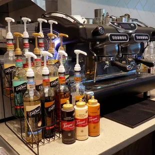 Various flavor syrups and our espresso machine