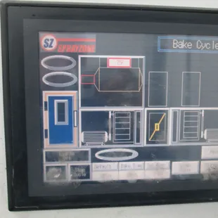 Touchscreen, fully climate controlled complete downdraft paint booth.