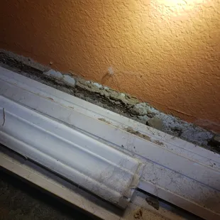 Termite damage very evident here. Baseboards were laying in front of that area.
