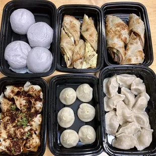 a variety of dumplings in plastic containers