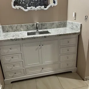 bathroom vanity with sink and mirror