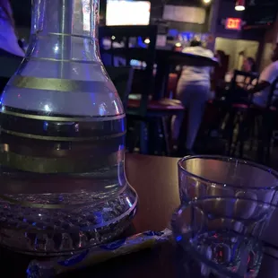 a pitcher of water and a glass of water