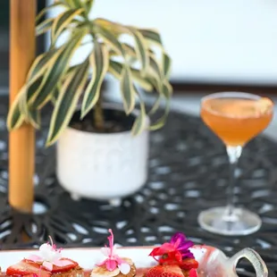 a plate of toast with strawberries and bananas