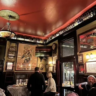 a group of people sitting at a bar