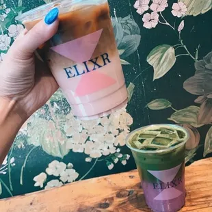 a hand holding a cup of coffee