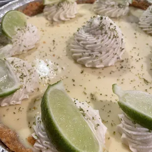 a pie with limes and whipped cream