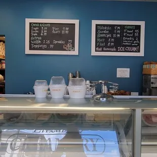 a display case with a variety of desserts