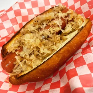 a hot dog with sauerkraut