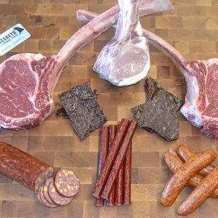 a variety of meats on a cutting board