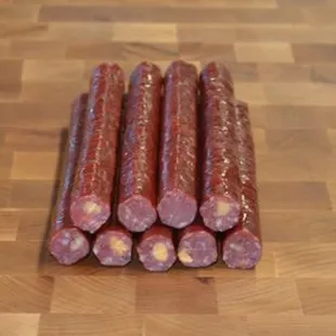 sliced sausages on a cutting board