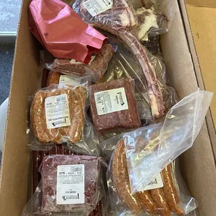 A variety of meats and dog bones