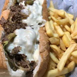 Cheese steak sub with fries