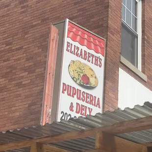a sign on the side of a building