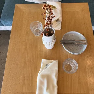 a place setting on a wooden table