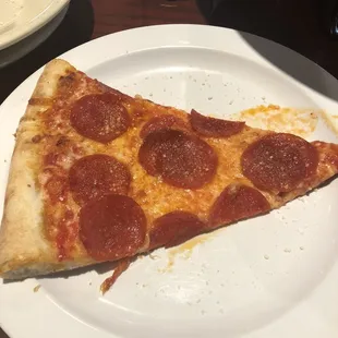 a slice of pepperoni pizza
