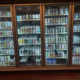 a refrigerator full of cans of beer