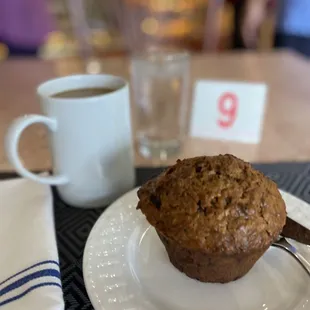 a muffin and a cup of coffee