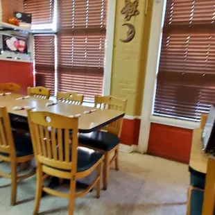 a dining room with a table and chairs