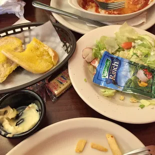 Here&apos;s the packets of dressing and the nine roasted garlic bread