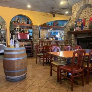a dining area with tables and chairs