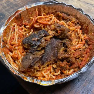 a plate of spaghetti and meat
