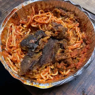 a plate of spaghetti and meat