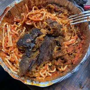 a plate of spaghetti and meat