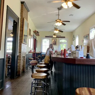 Upstairs is bright and sunny. Seating at the bar is available.