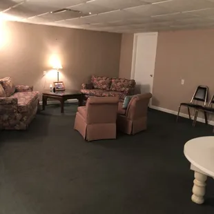 Sitting room in the basement when you enter the women's bathroom