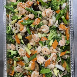 shrimp, broccoli, and carrots in a container