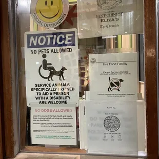 Is it fair to say they hate dogs? People can read a single sign and understand "no dogs".