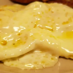 a plate of food with eggs and sausage