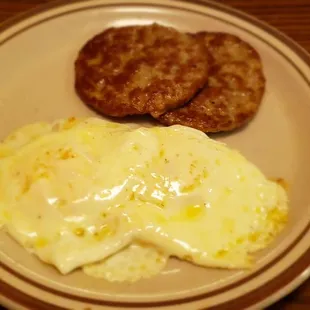 a plate of eggs and sausage