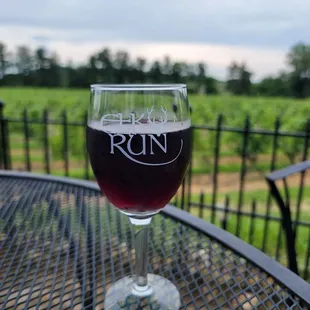 a glass of wine on a table